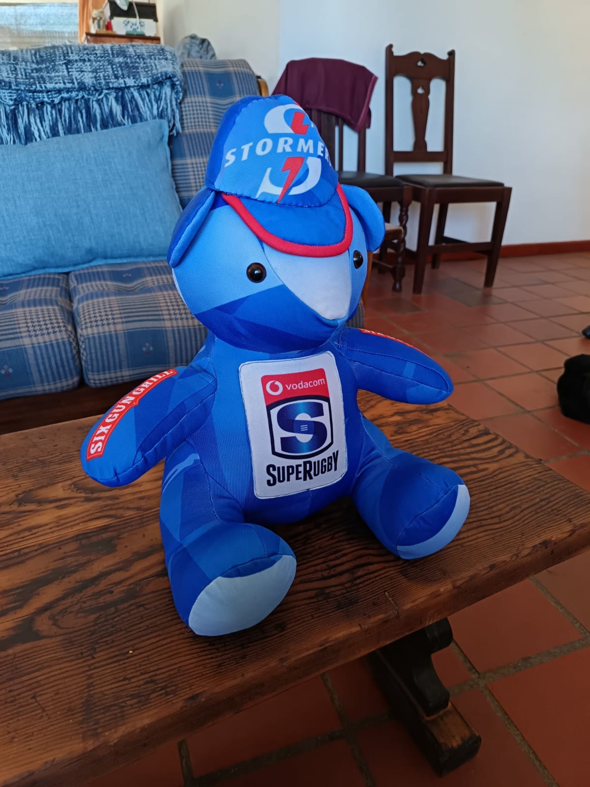 A teddy bear sewn from a blue Stormers rugby jersey and cap, with the Vodacom Super Rugby badge on its chest